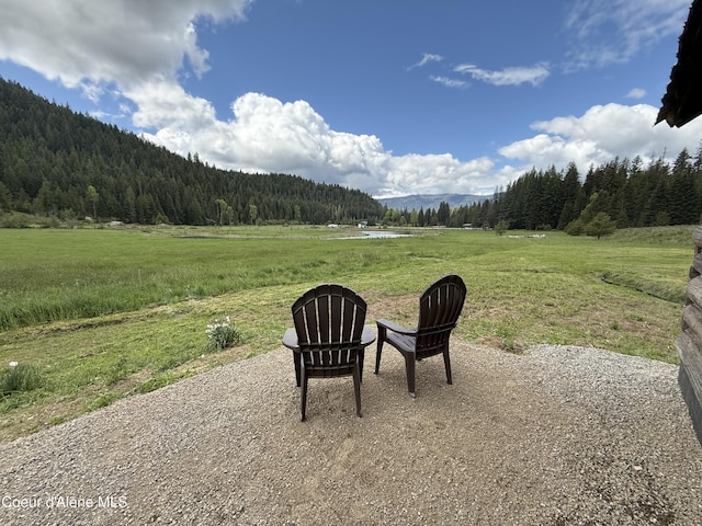 408 Quartz Crk Rd, Priest River, ID 83856 - view of patio with a forest view, a view of countryside, and a mountain view
