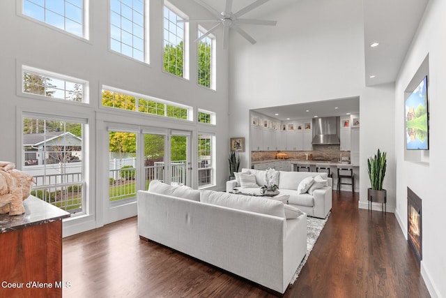 2946 E Point Hayden Dr, Hayden Lake, ID 83835 - living area with a towering ceiling, a ceiling fan, dark wood-style flooring, baseboards, and recessed lighting