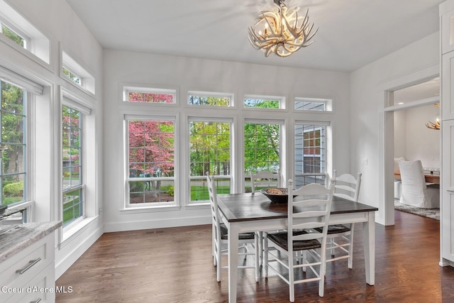 2946 E Point Hayden Dr, Hayden Lake, ID 83835 - dining room featuring a chandelier, baseboards, and dark wood-style flooring