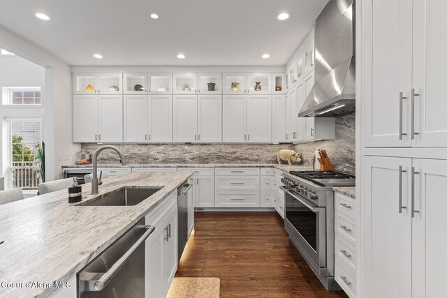 2946 E Point Hayden Dr, Hayden Lake, ID 83835 - kitchen featuring appliances with stainless steel finishes, a sink, wall chimney range hood, recessed lighting, and white cabinets