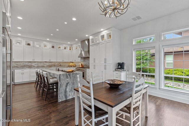 2946 E Point Hayden Dr, Hayden Lake, ID 83835 - dining space with a chandelier, recessed lighting, and dark wood-type flooring