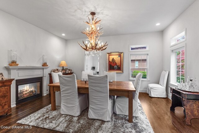 2946 E Point Hayden Dr, Hayden Lake, ID 83835 - dining space with a chandelier, wood finished floors, recessed lighting, a glass covered fireplace, and baseboards