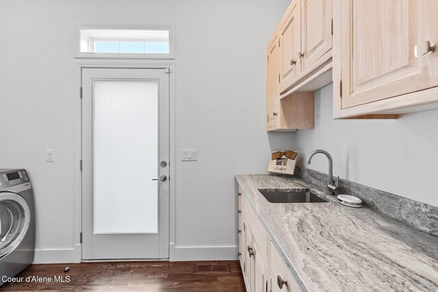 2946 E Point Hayden Dr, Hayden Lake, ID 83835 - washroom featuring washer / dryer, cabinet space, baseboards, and dark wood finished floors
