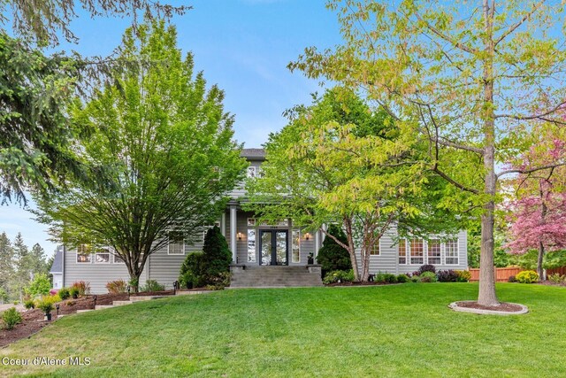 2946 E Point Hayden Dr, Hayden Lake, ID 83835 - view of property hidden behind natural elements featuring french doors and a front lawn