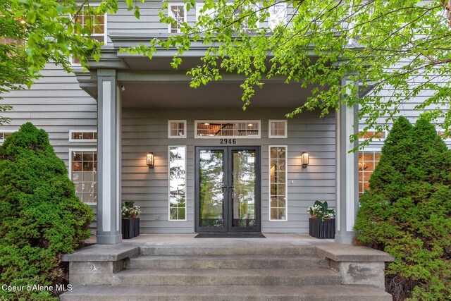2946 E Point Hayden Dr, Hayden Lake, ID 83835 - view of exterior entry featuring french doors and covered porch