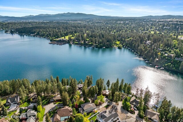 2946 E Point Hayden Dr, Hayden Lake, ID 83835 - aerial view of residential area with a water and mountain view and a heavily wooded area