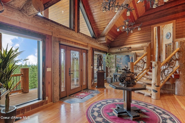 17442 S Painted Rose Rd, Worley, ID 83876 - foyer entrance featuring wood-type flooring, a chandelier, wooden ceiling with exposed beams, stairway, and high vaulted ceiling