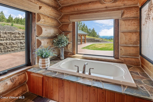 17442 S Painted Rose Rd, Worley, ID 83876 - full bathroom featuring log walls, healthy amount of natural light, and a garden tub