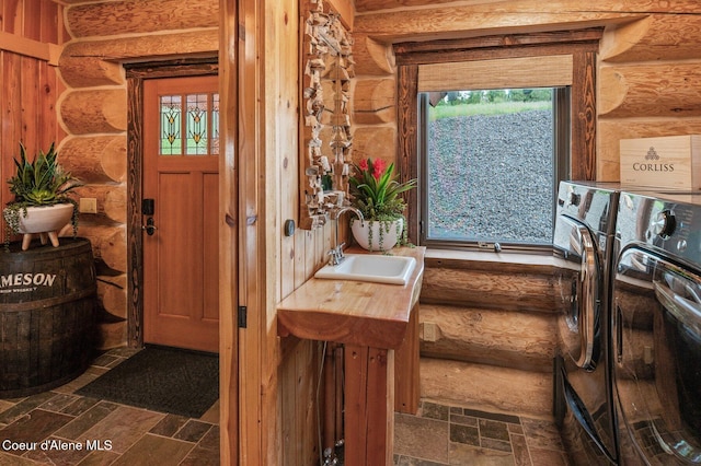 17442 S Painted Rose Rd, Worley, ID 83876 - laundry room with independent washer and dryer and log walls