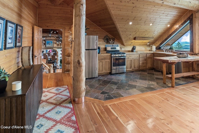 17442 S Painted Rose Rd, Worley, ID 83876 - kitchen with appliances with stainless steel finishes, wooden walls, wooden ceiling, dark wood finished floors, and light countertops