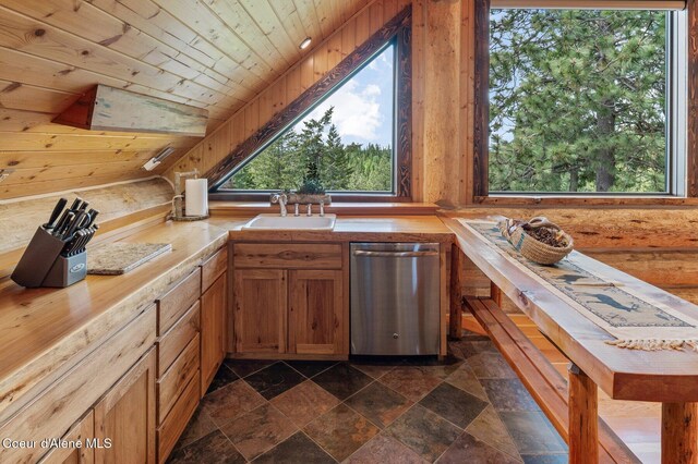17442 S Painted Rose Rd, Worley, ID 83876 - kitchen featuring stainless steel dishwasher, a sink, wood ceiling, dark stone finish floors, and brown cabinets