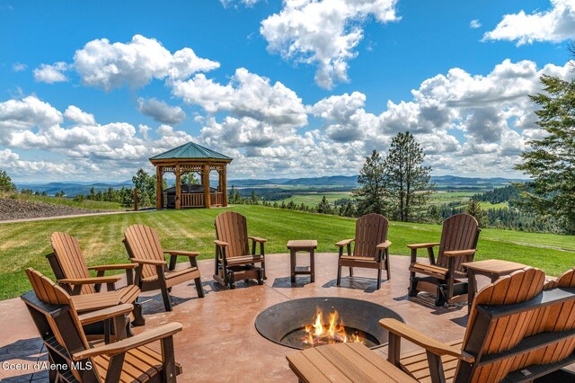 17442 S Painted Rose Rd, Worley, ID 83876 - view of patio / terrace with a fire pit, a gazebo, and a mountain view