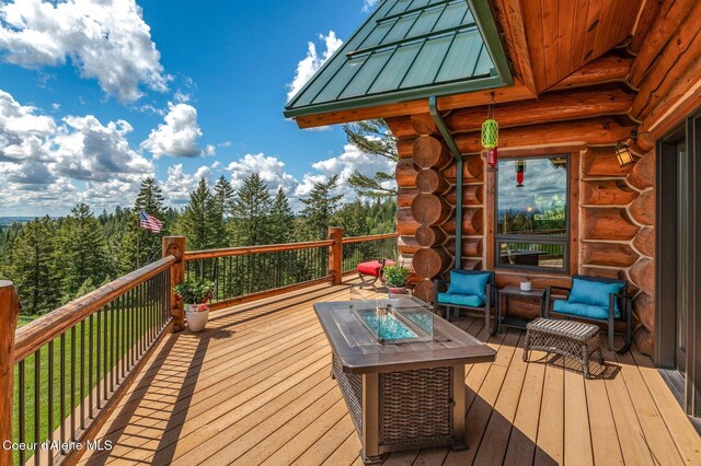 17442 S Painted Rose Rd, Worley, ID 83876 - wooden deck featuring an outdoor fire pit