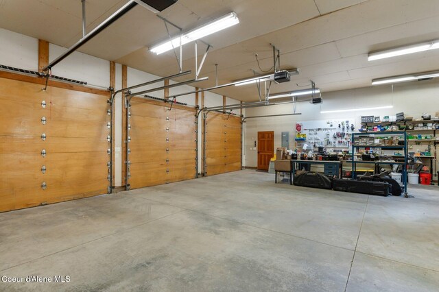 17442 S Painted Rose Rd, Worley, ID 83876 - garage with a garage door opener and a workshop area