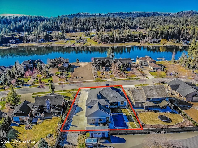 4732 W Mill River Ct, Coeur Dalene, ID 83814 - aerial perspective of suburban area with property boundaries highlighted, a forest, and a nearby body of water