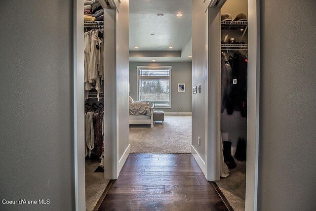 4732 W Mill River Ct, Coeur Dalene, ID 83814 - hall featuring dark wood finished floors, recessed lighting, a textured wall, baseboards, and dark carpet