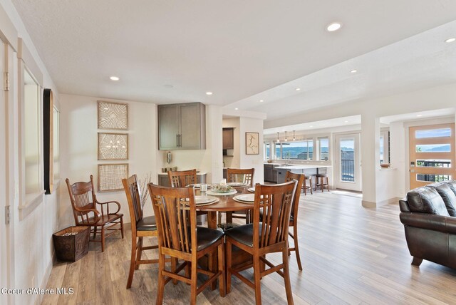 2406 S Silver Beach Rd, Coeur Dalene, ID 83814 - dining room with light wood-type flooring, recessed lighting, and baseboards