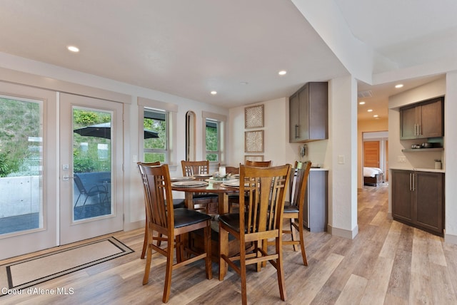 2406 S Silver Beach Rd, Coeur Dalene, ID 83814 - dining space featuring light wood-style floors, recessed lighting, and baseboards