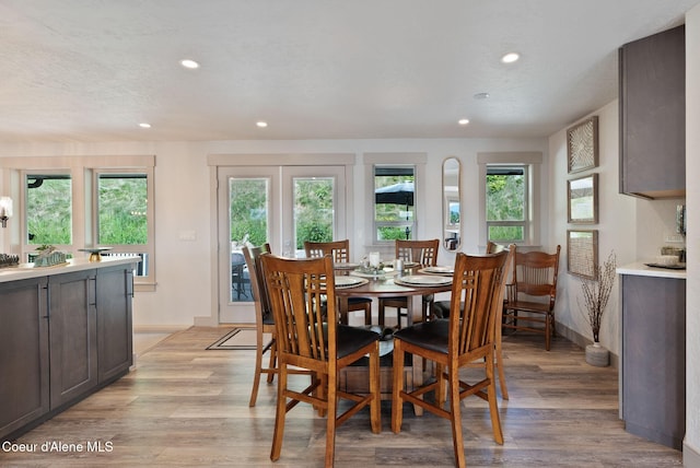 2406 S Silver Beach Rd, Coeur Dalene, ID 83814 - dining room with recessed lighting, light wood-style floors, and baseboards
