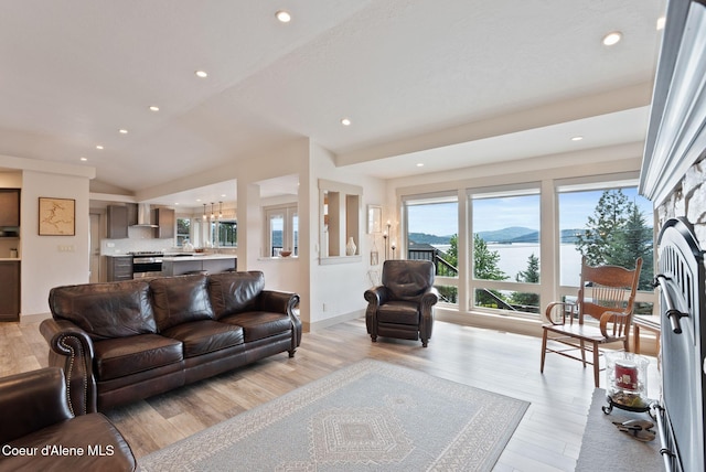 2406 S Silver Beach Rd, Coeur Dalene, ID 83814 - living room with light wood-style flooring, recessed lighting, and a water view
