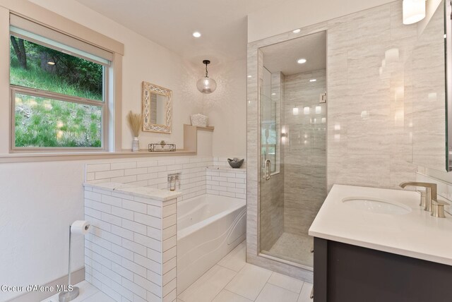 2406 S Silver Beach Rd, Coeur Dalene, ID 83814 - full bath with vanity, a garden tub, a stall shower, and tile patterned flooring