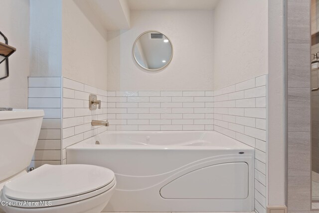 2406 S Silver Beach Rd, Coeur Dalene, ID 83814 - full bath featuring toilet, a bath, and tile walls