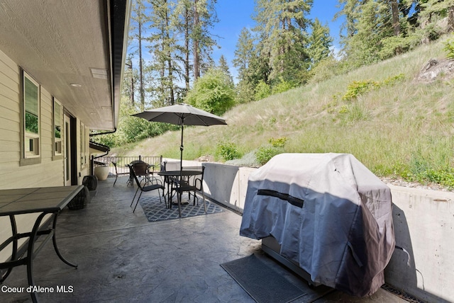 2406 S Silver Beach Rd, Coeur Dalene, ID 83814 - view of patio featuring outdoor dining area and grilling area