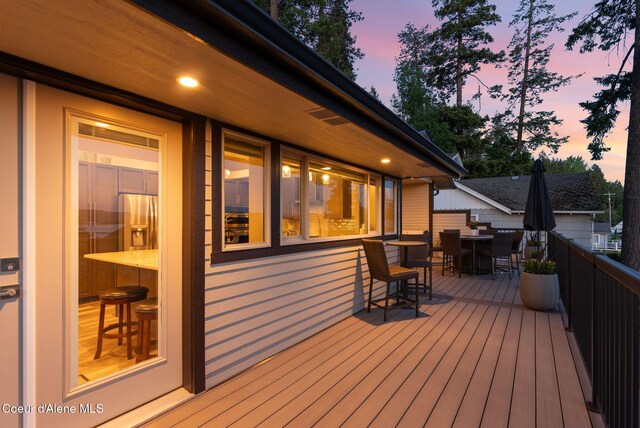 2406 S Silver Beach Rd, Coeur Dalene, ID 83814 - wooden deck featuring outdoor dining space