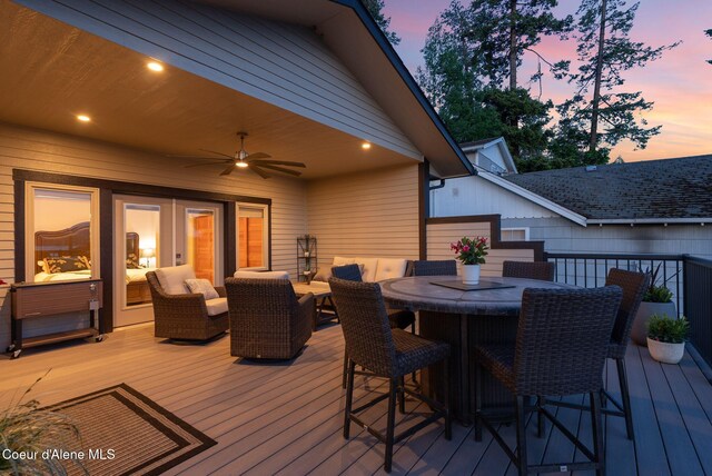 2406 S Silver Beach Rd, Coeur Dalene, ID 83814 - deck with a ceiling fan and outdoor dining space