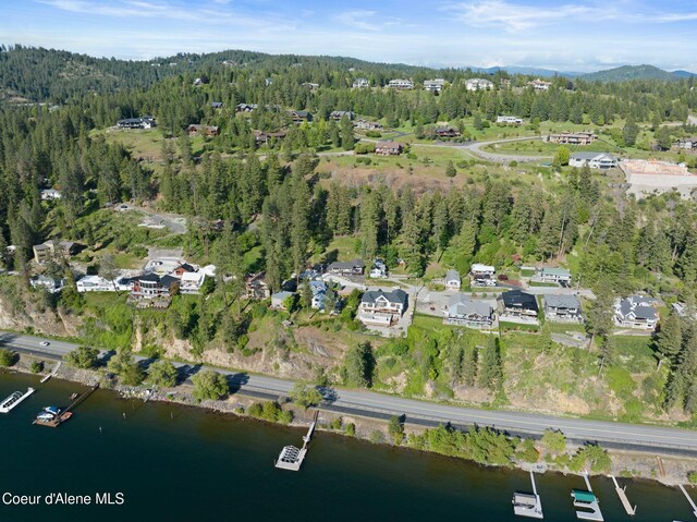 2406 S Silver Beach Rd, Coeur Dalene, ID 83814 - aerial overview of property's location featuring a heavily wooded area and a nearby body of water