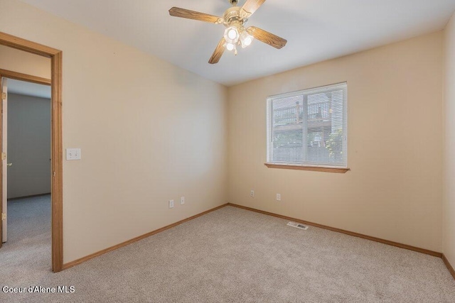 11221 N Crusader St, Hayden, ID 83835 - spare room with carpet, baseboards, and ceiling fan