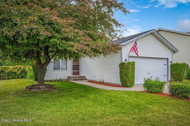 11221 N Crusader St, Hayden, ID 83835 - view of front of house featuring an attached garage and a front lawn