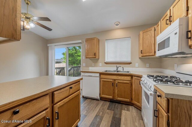 11221 N Crusader St, Hayden, ID 83835 - kitchen with white appliances, a sink, light wood-type flooring, a ceiling fan, and light countertops