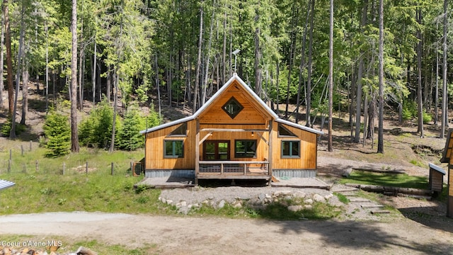 99 Broten Way, Sagle, ID 83860 - view of front of home featuring a forest view and a deck
