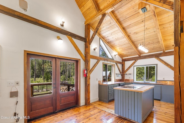 99 Broten Way, Sagle, ID 83860 - kitchen featuring gray cabinets, wooden counters, french doors, wooden ceiling with exposed beams, and light wood-type flooring