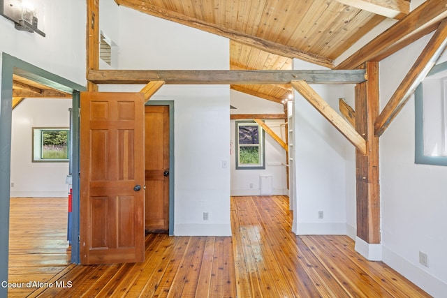 99 Broten Way, Sagle, ID 83860 - unfurnished living room featuring hardwood / wood-style floors, baseboards, and wooden ceiling