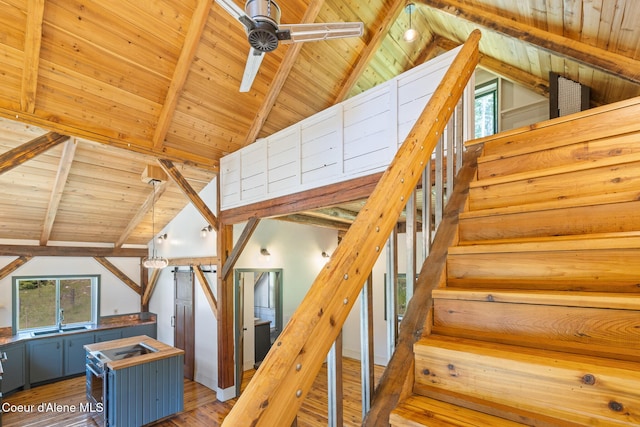 99 Broten Way, Sagle, ID 83860 - stairs featuring healthy amount of natural light, ceiling fan, wooden ceiling, and hardwood / wood-style floors