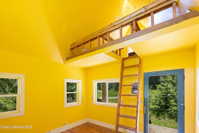 99 Broten Way, Sagle, ID 83860 - doorway to outside with wood finished floors, a towering ceiling, and baseboards