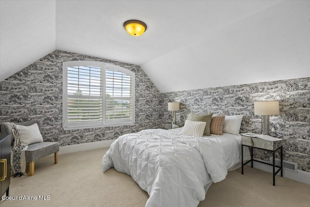 1874 W Polo Green Ave, Post Falls, ID 83854 - carpeted bedroom featuring wallpapered walls and lofted ceiling