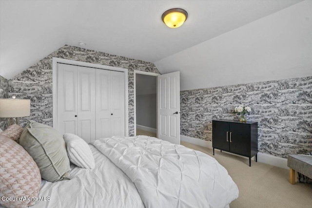 1874 W Polo Green Ave, Post Falls, ID 83854 - carpeted bedroom featuring vaulted ceiling, wallpapered walls, a closet, and baseboards