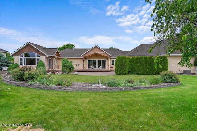 1874 W Polo Green Ave, Post Falls, ID 83854 - rear view of property featuring a lawn