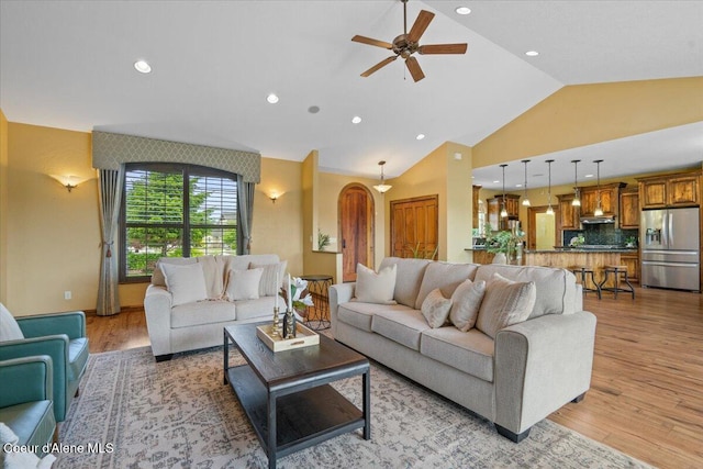 1874 W Polo Green Ave, Post Falls, ID 83854 - living room with lofted ceiling, a ceiling fan, light wood-style flooring, and recessed lighting