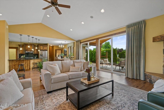 1874 W Polo Green Ave, Post Falls, ID 83854 - living room with a ceiling fan, light wood finished floors, recessed lighting, high vaulted ceiling, and a chandelier