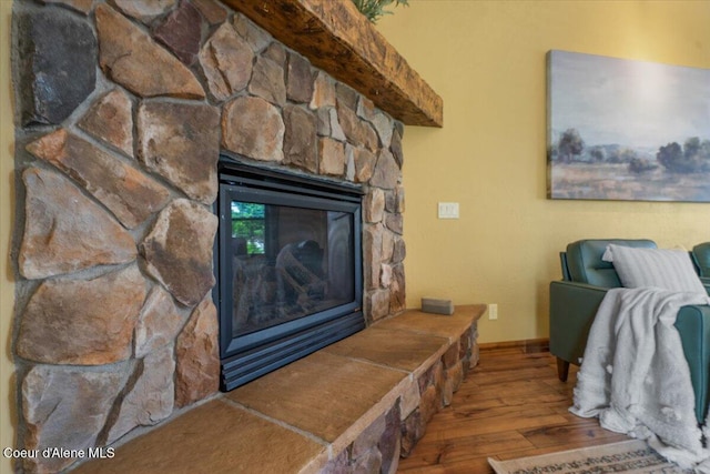 1874 W Polo Green Ave, Post Falls, ID 83854 - detailed view of wood finished floors, a fireplace, and baseboards