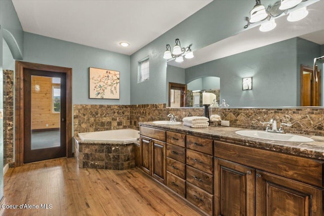 1874 W Polo Green Ave, Post Falls, ID 83854 - bathroom with wood finished floors, a bath, and double vanity