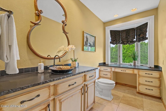 1874 W Polo Green Ave, Post Falls, ID 83854 - bathroom featuring vanity, toilet, and tile patterned floors