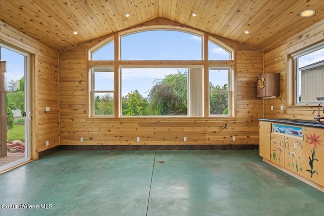 1874 W Polo Green Ave, Post Falls, ID 83854 - spare room with vaulted ceiling, finished concrete floors, recessed lighting, wood ceiling, and wood walls