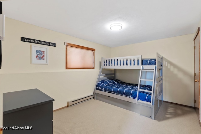 176 Swan Shores Dr, Sagle, ID 83860 - bedroom with carpet, a baseboard heating unit, and baseboards