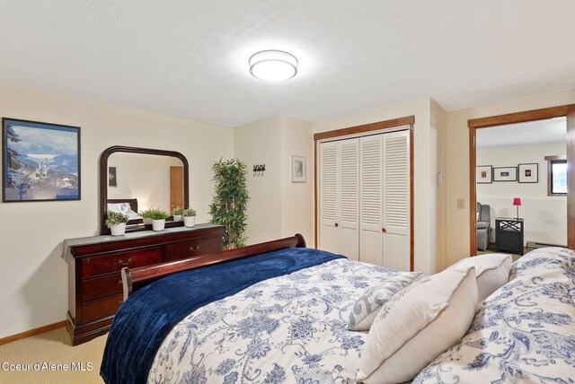176 Swan Shores Dr, Sagle, ID 83860 - carpeted bedroom featuring a closet and baseboards