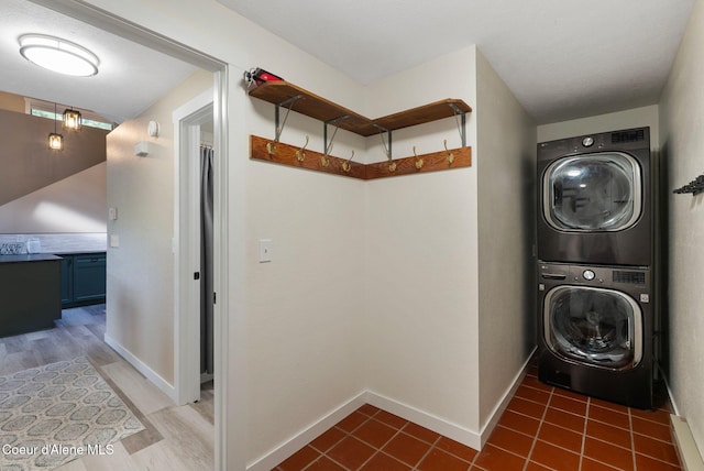 176 Swan Shores Dr, Sagle, ID 83860 - washroom with stacked washer and clothes dryer and baseboards